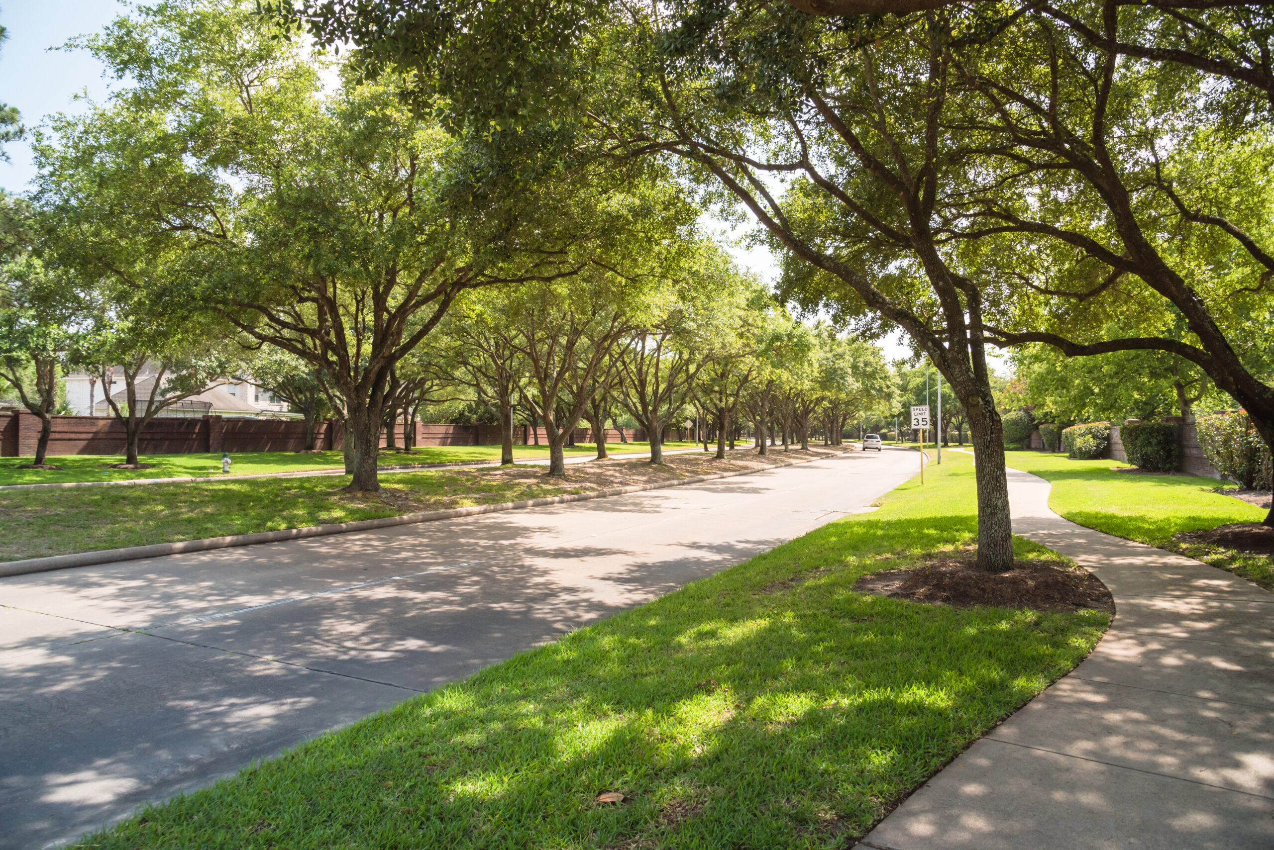 Side,View,Of,Asphalt,Road,,Street,In,Suburban,Residential,Area Side View Of Asphalt Road Street In Suburban Residential Area